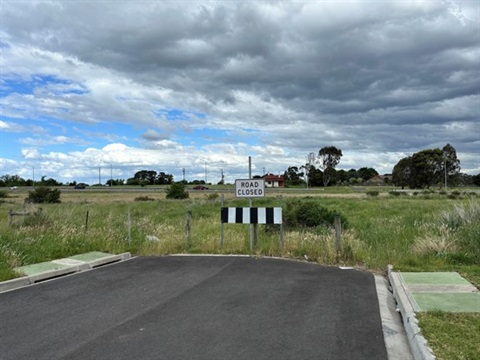 Looking towards the end of Everton Road, the site of the roadworks, which is currently a dead end street with a paddock behind it