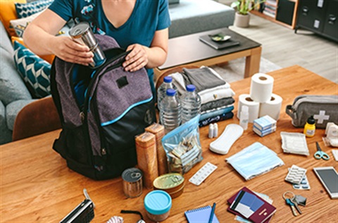 Unrecognizable woman putting cans food prepare