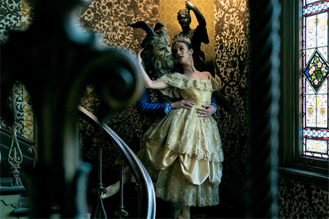 Ballet dancers, a female dressed in a gown & a man with prosthetics that make him look like a beast.