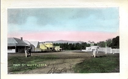 A painted image of a 1900 rural streetscape.