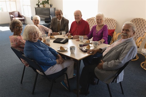 Seniors sitting around a table